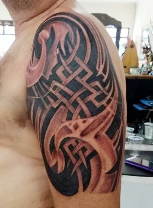 Black tribal tattoo with shading on a shoulder and upper arm, Canggu Bali